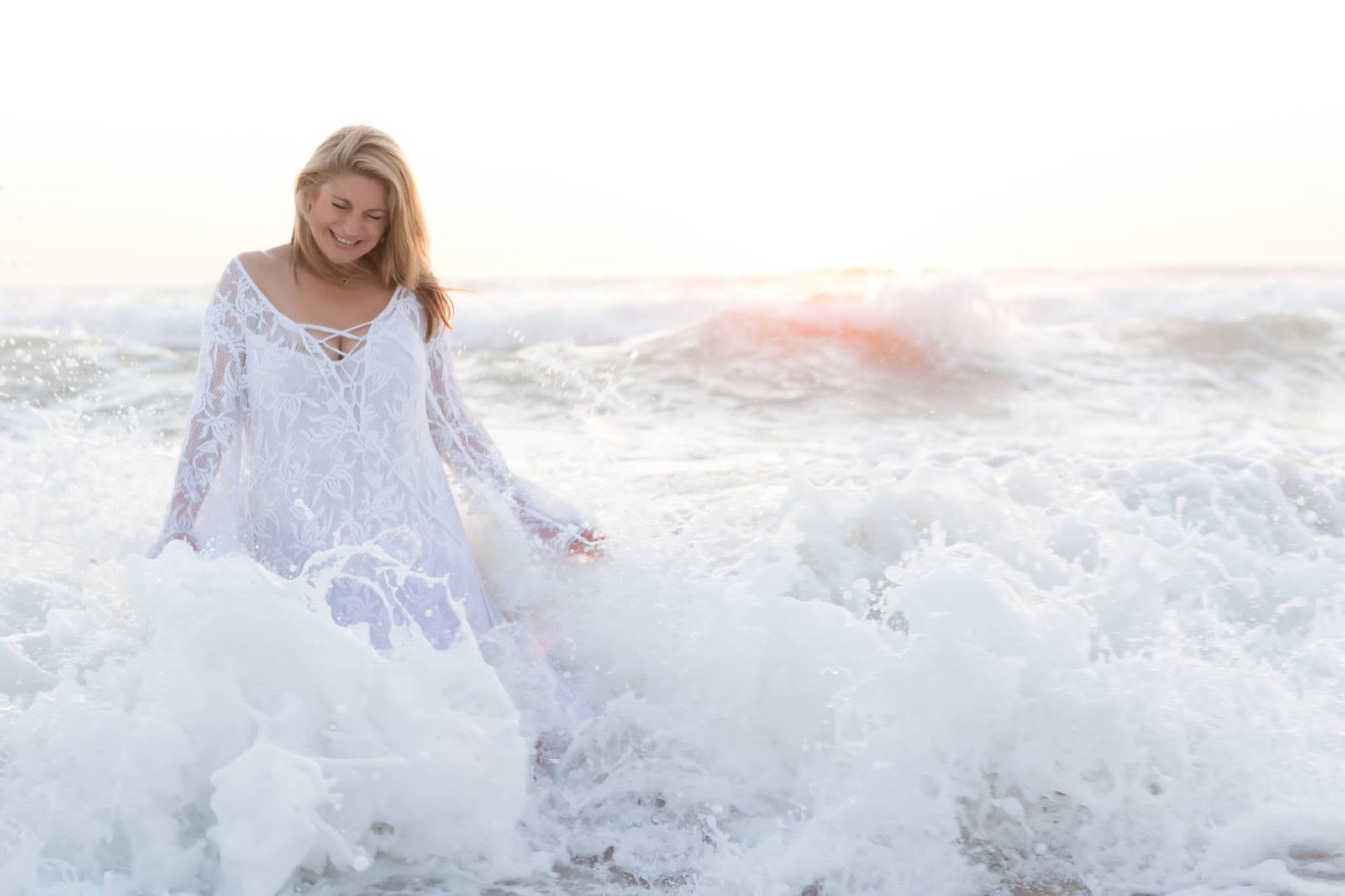 Maria Therase laughing in the ocean waves